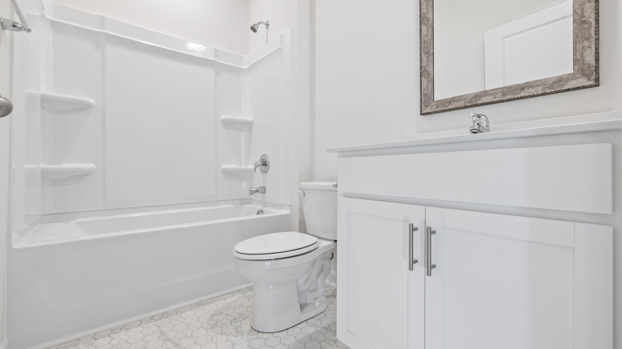 Bathroom with vanity and tub.