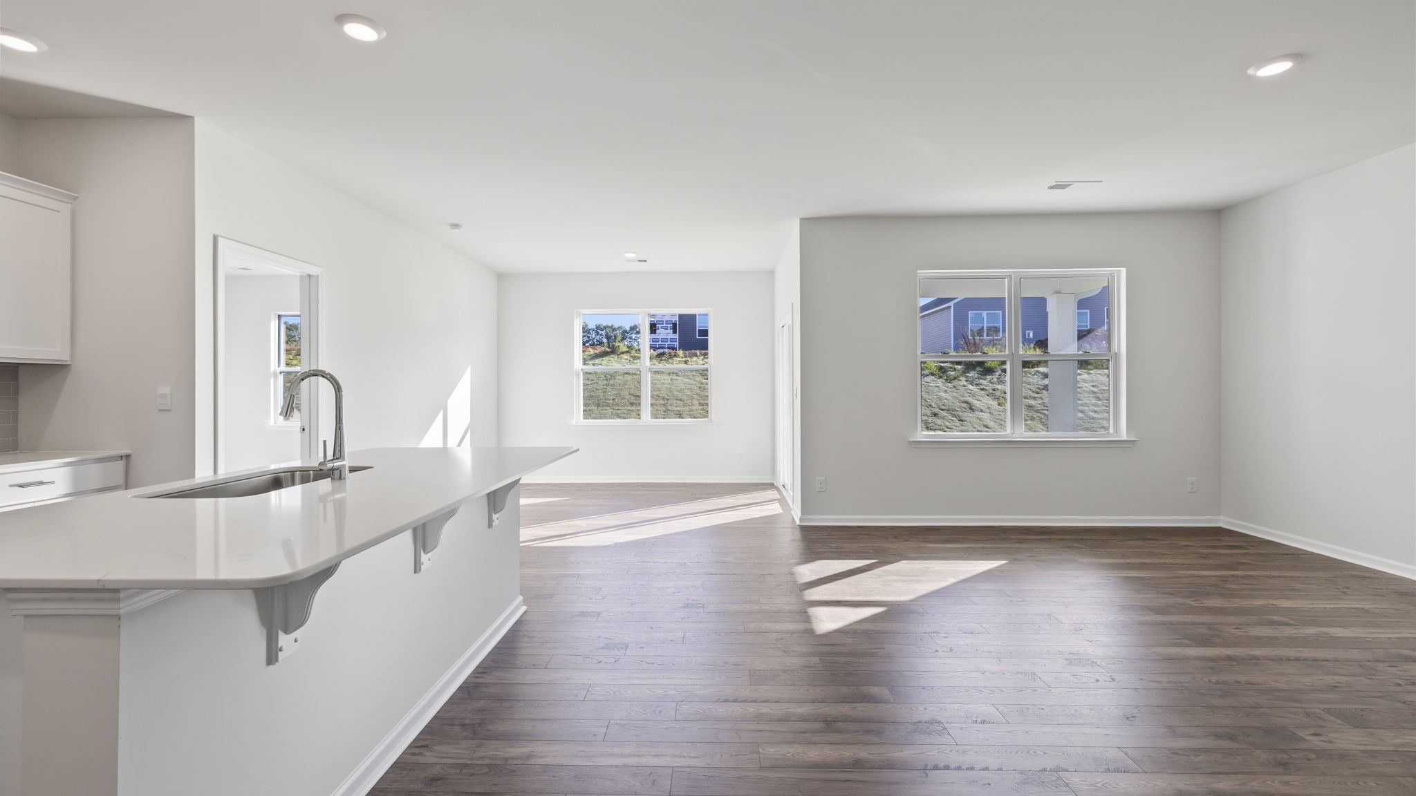 Kitchen and island with granite counter tops.