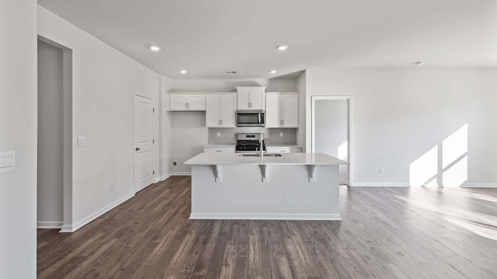 Kitchen and island with granite counter tops.