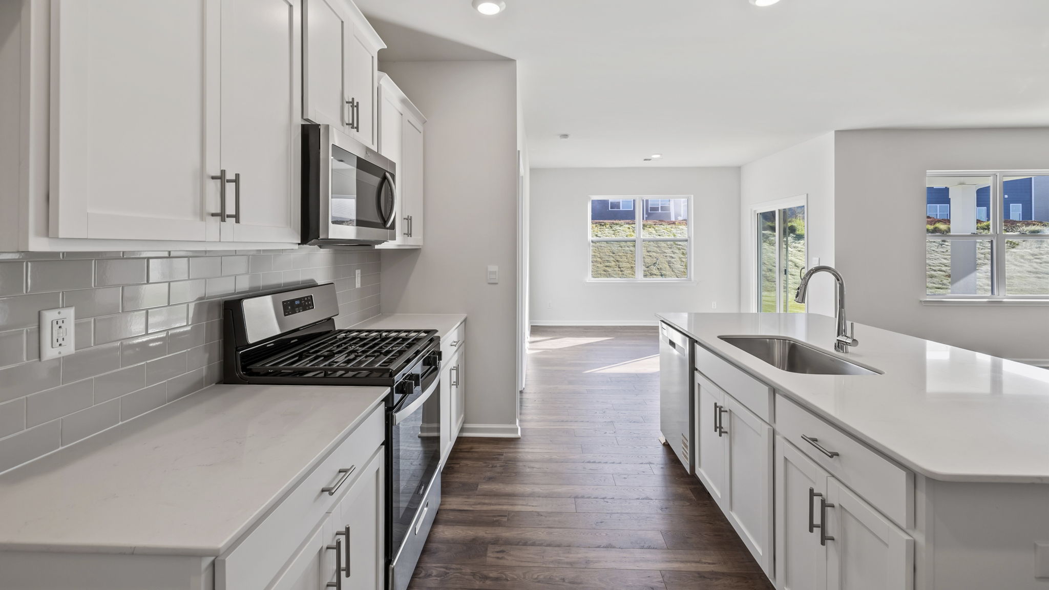 Kitchen and island with granite counter tops.