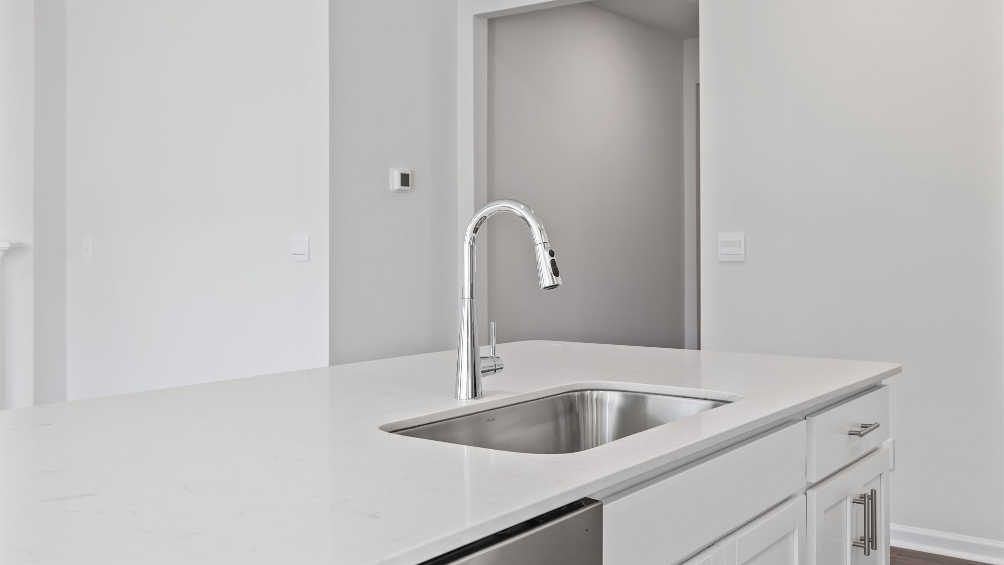 Kitchen and island with granite counter tops.