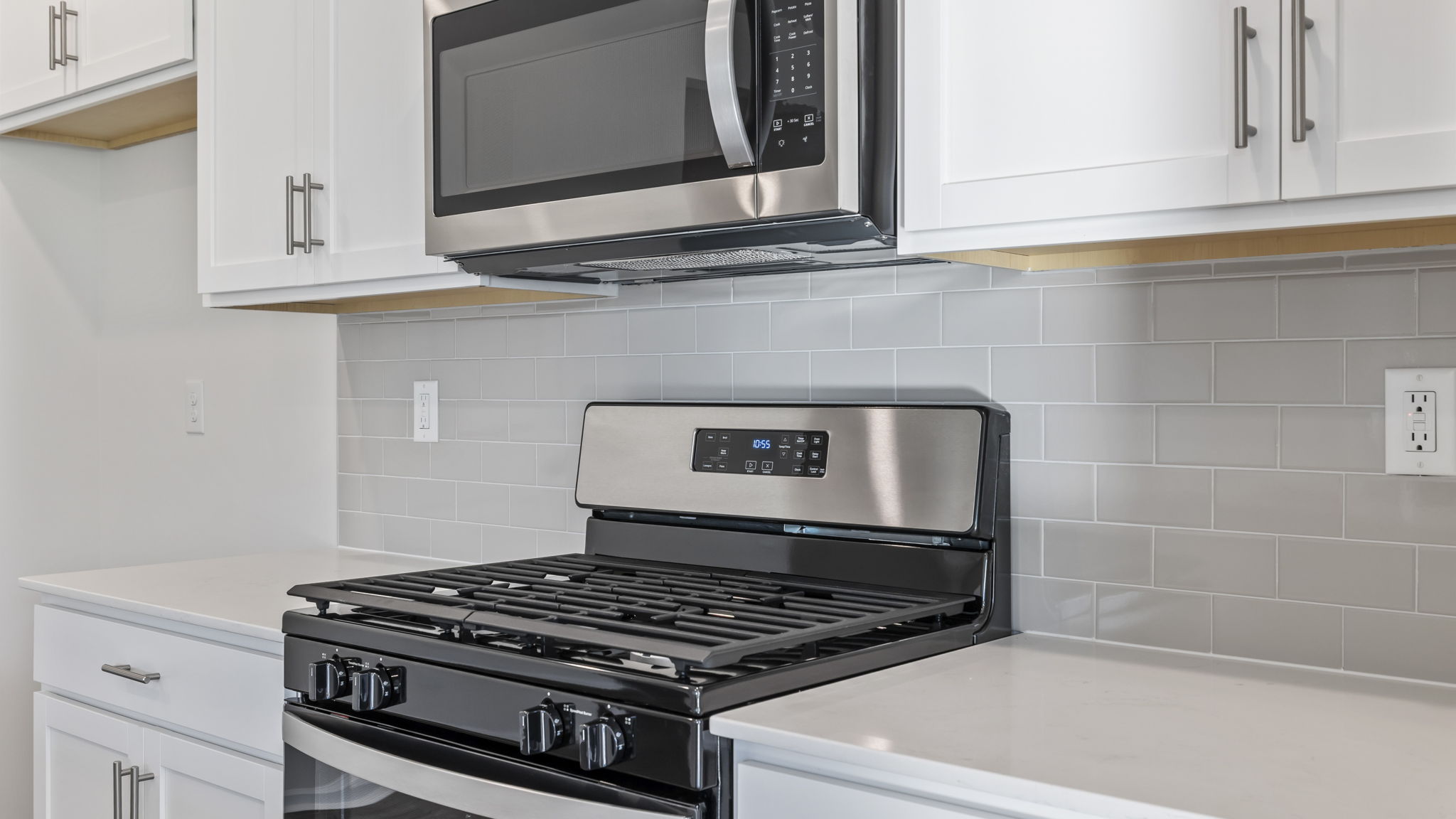 Kitchen with granite counter tops and stainless steel appliances.