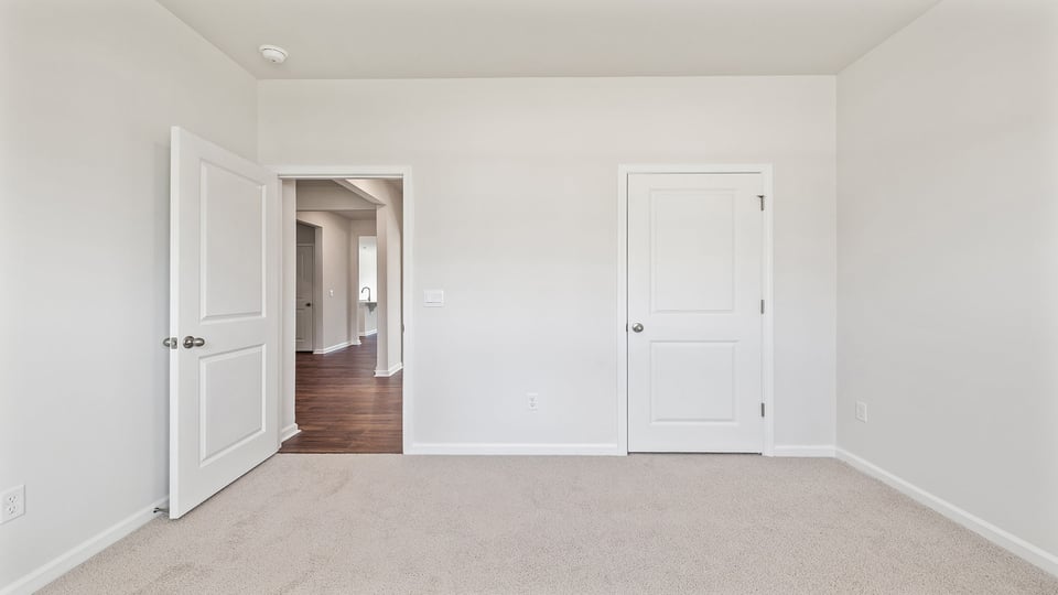 Bedroom with carpet.