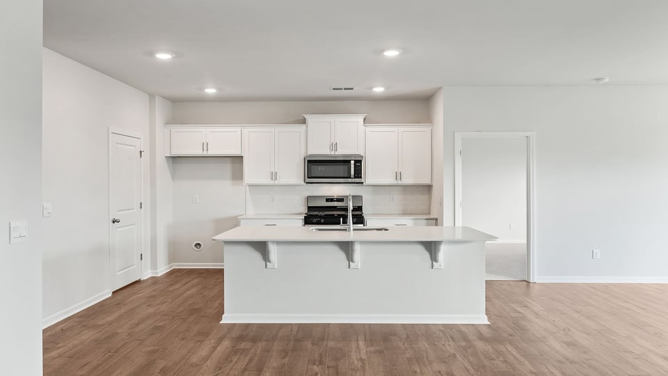 Living room facing kitchen.