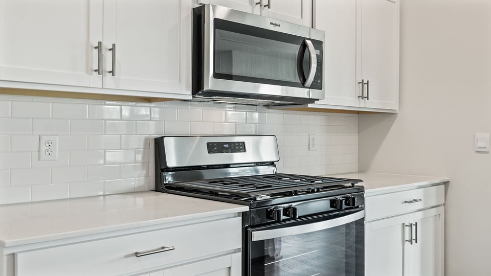 Kitchen with granite countertops and stainless steel appliances.