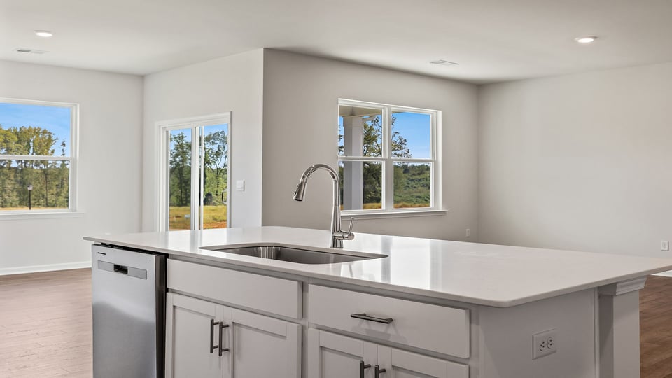 Kitchen and island with granite countertops.