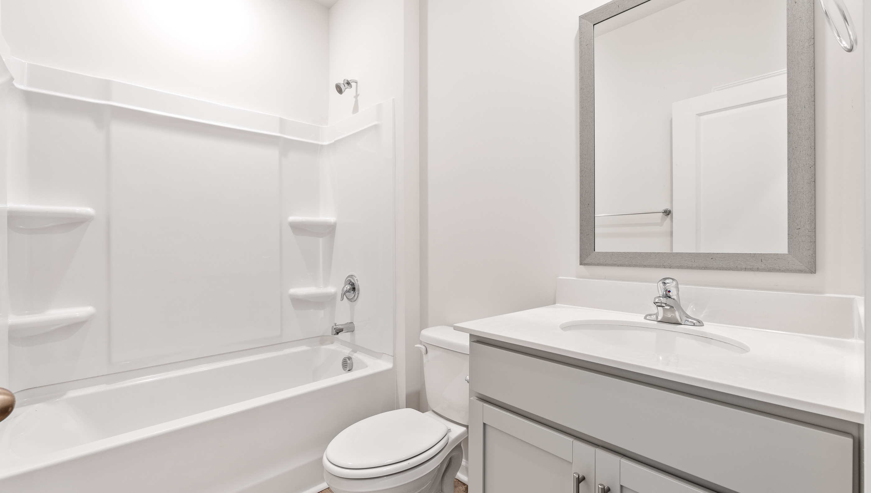 Bathroom with vanity and showertub.