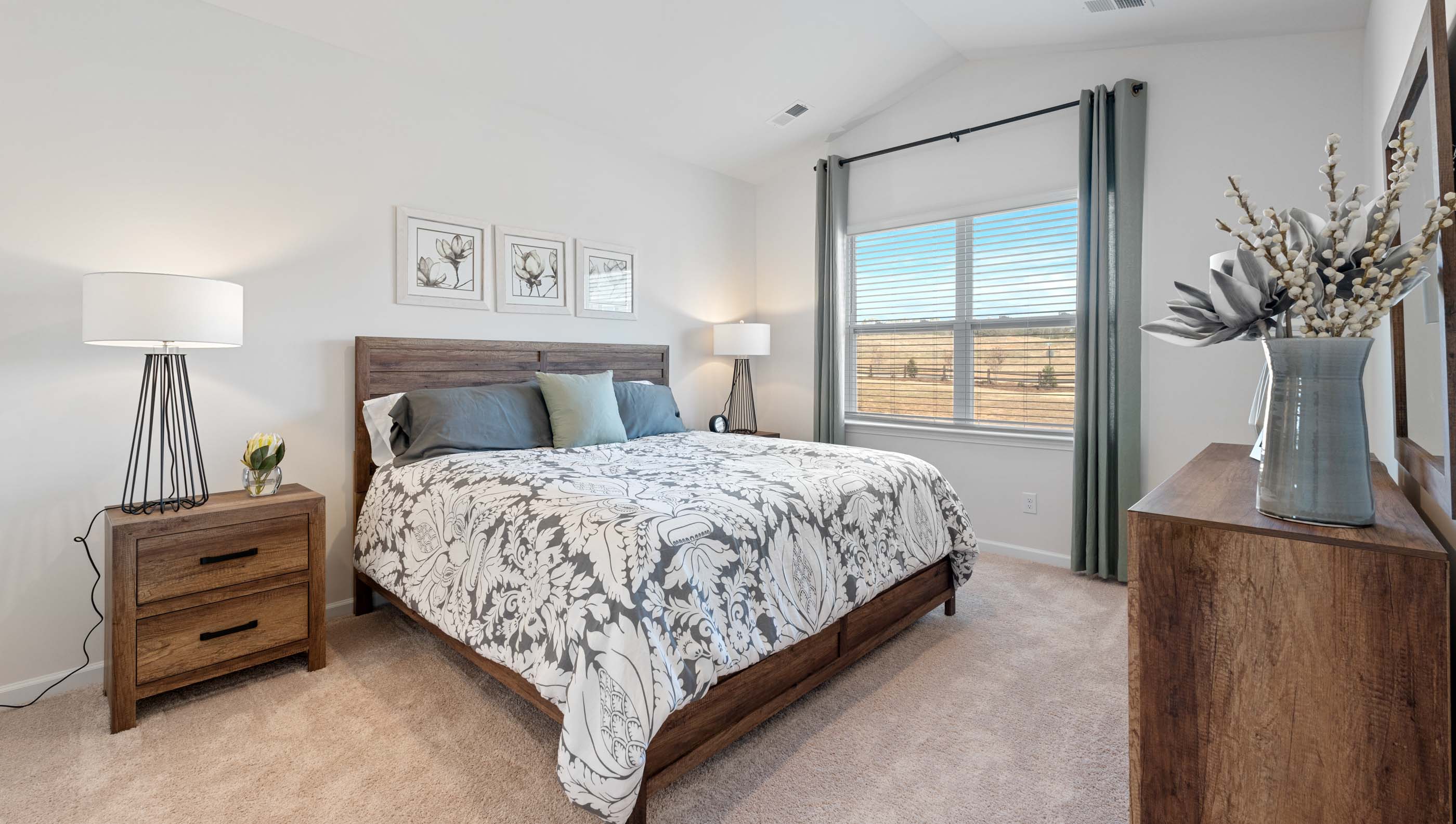 Bedroom with carpet and window.
