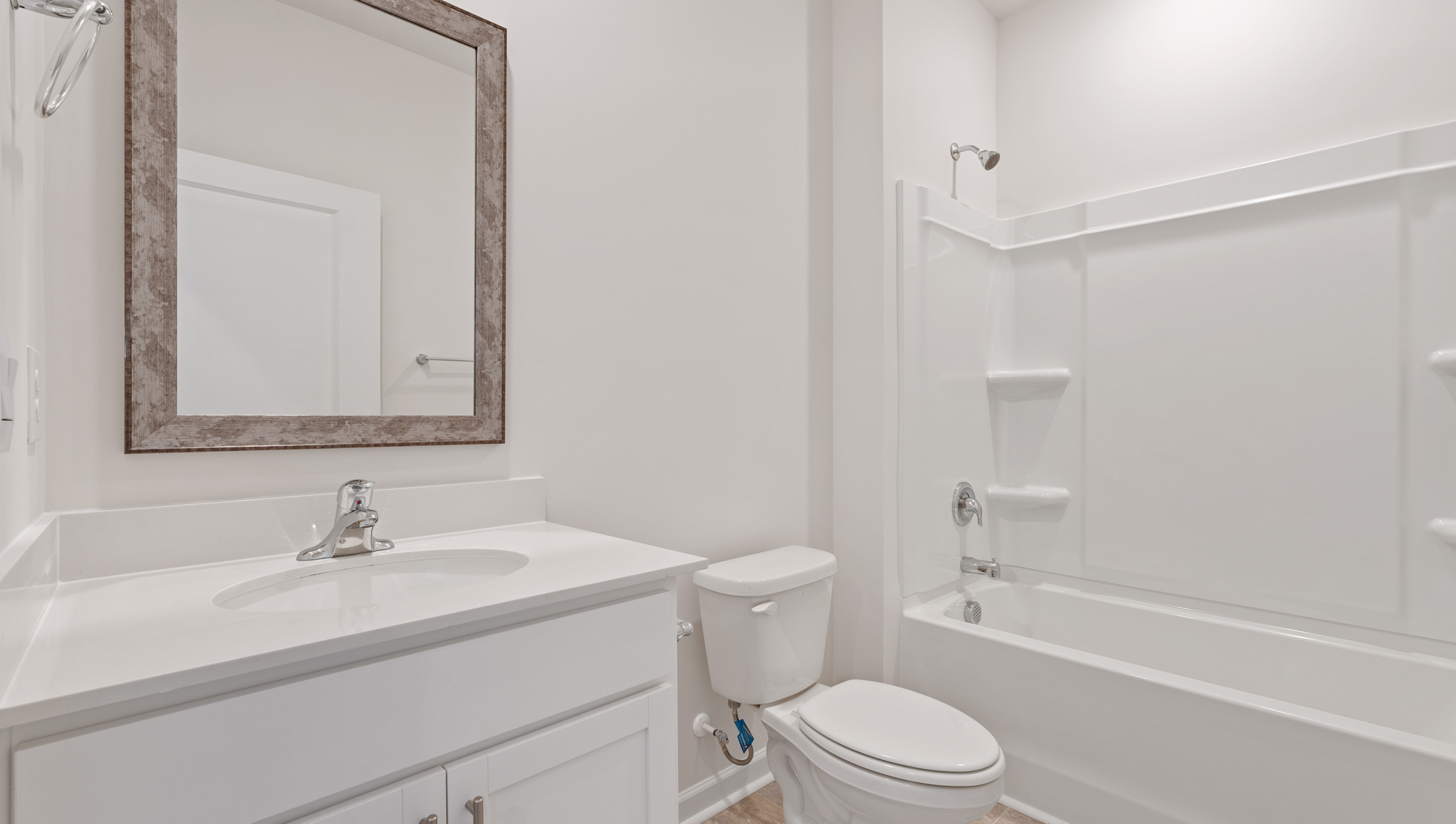 Bathroom with vanity and tub.