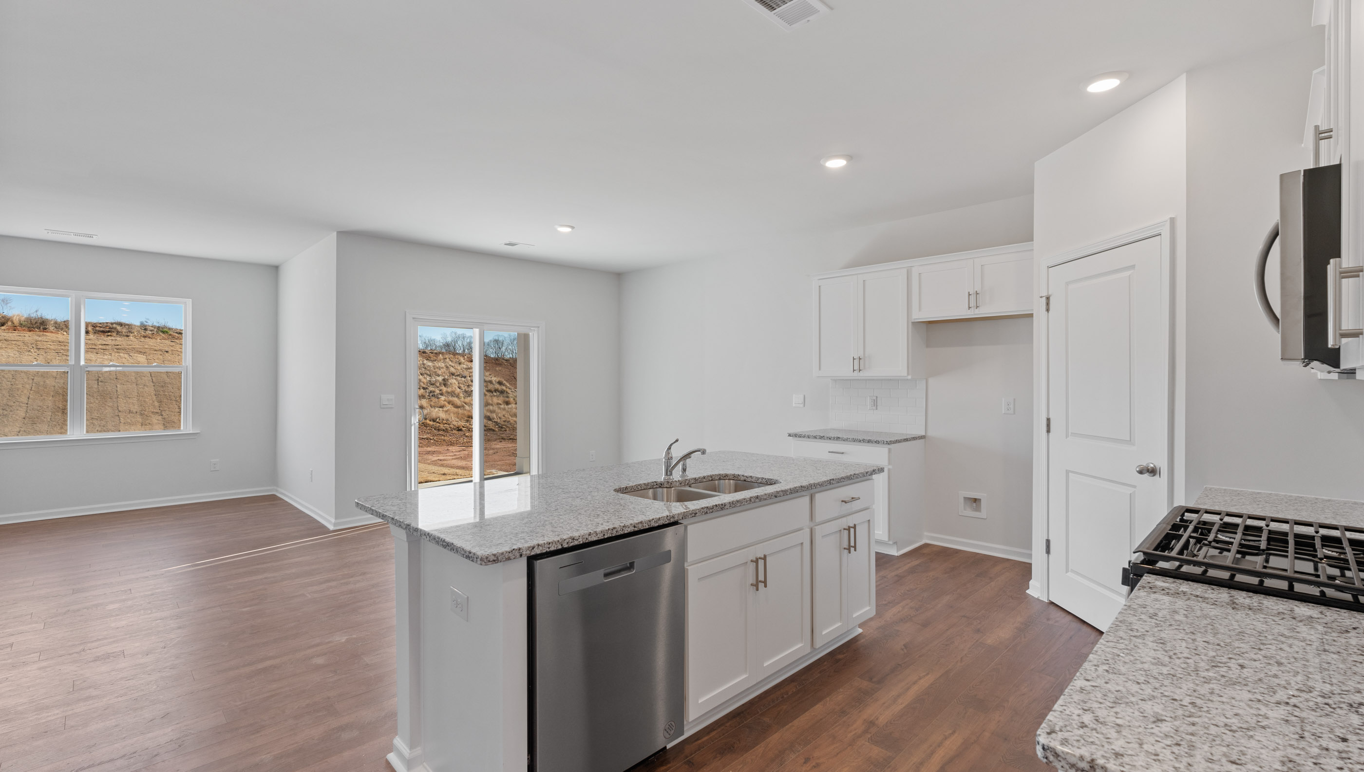 Kitchen and island with granite countertops.