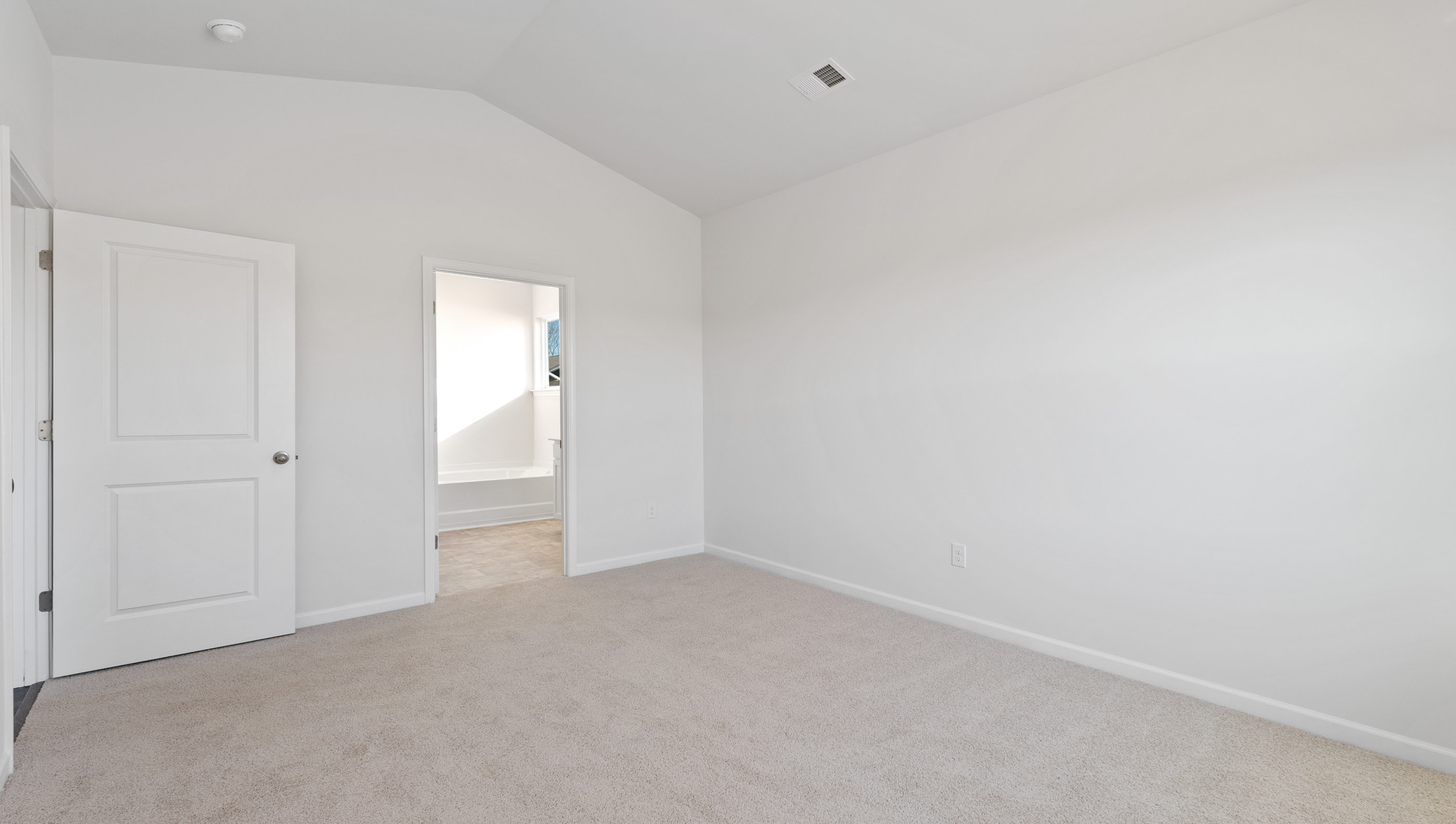 Bedroom with carpet.