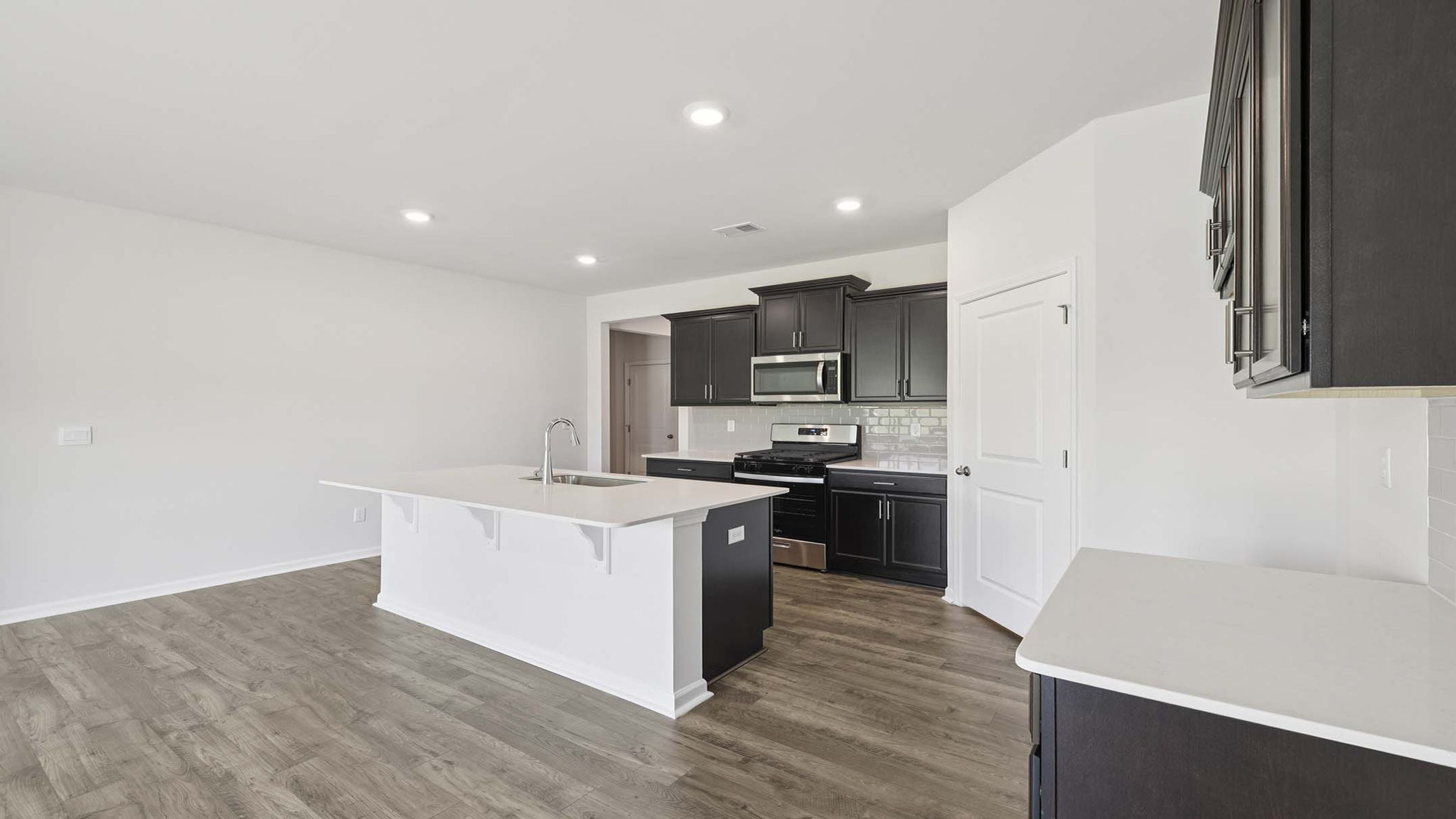 Kitchen with quartz countertops.