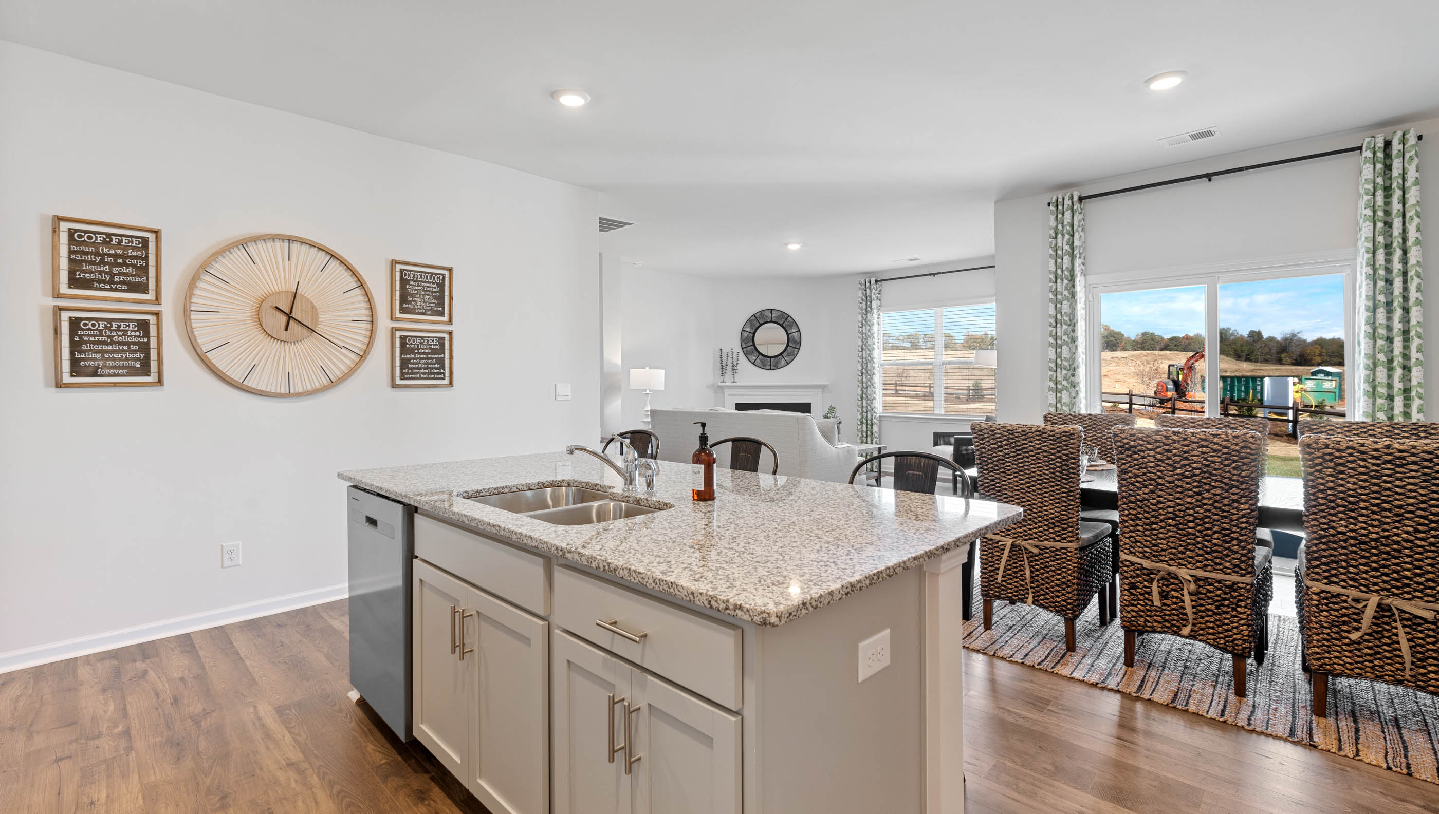 Kitchen and island with granite counter tops.