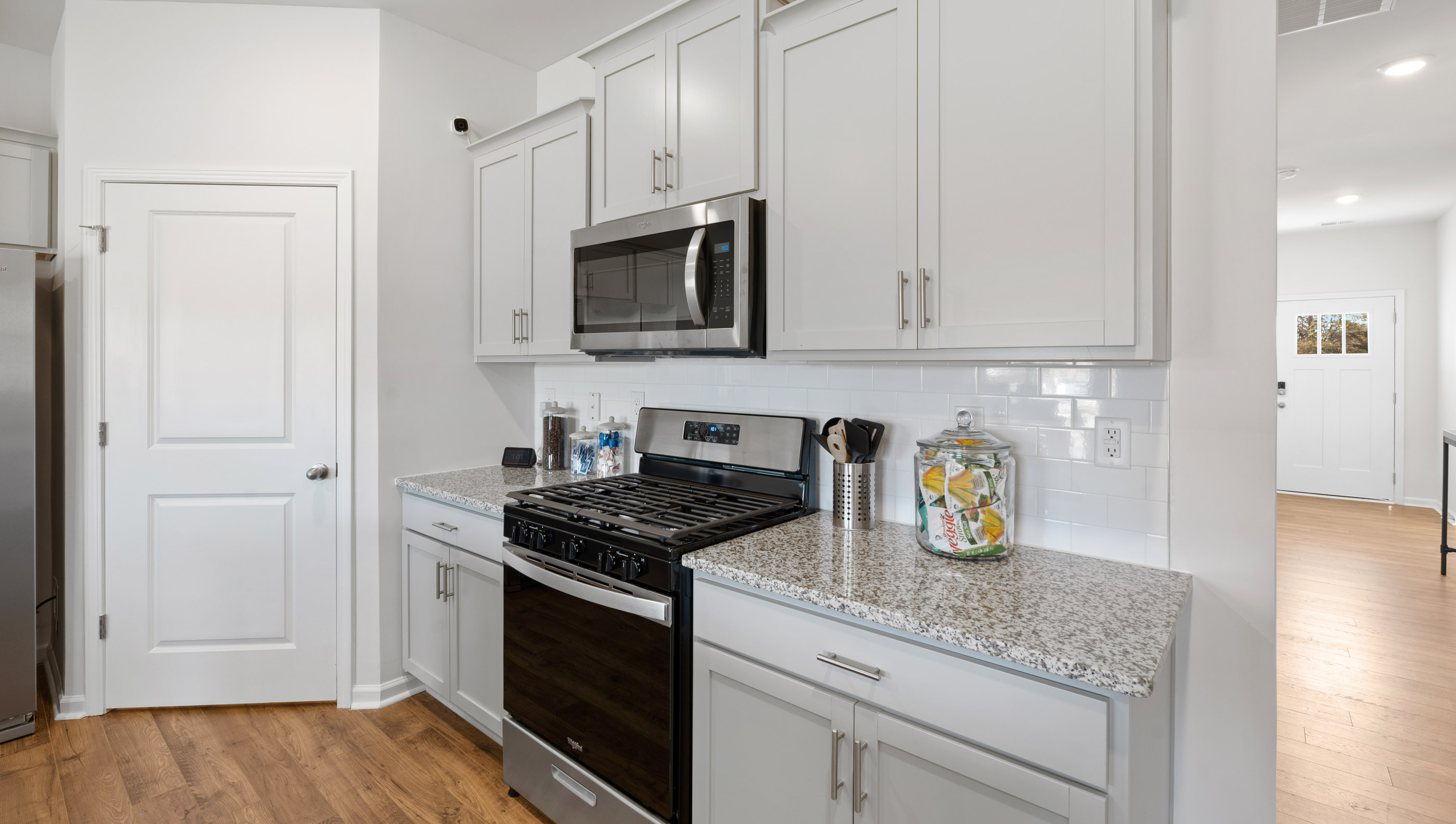 Kitchen and island with granite counter tops.