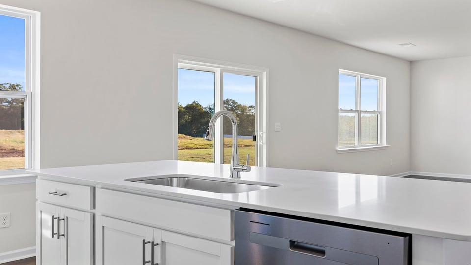 Kitchen and island with granite countertops.