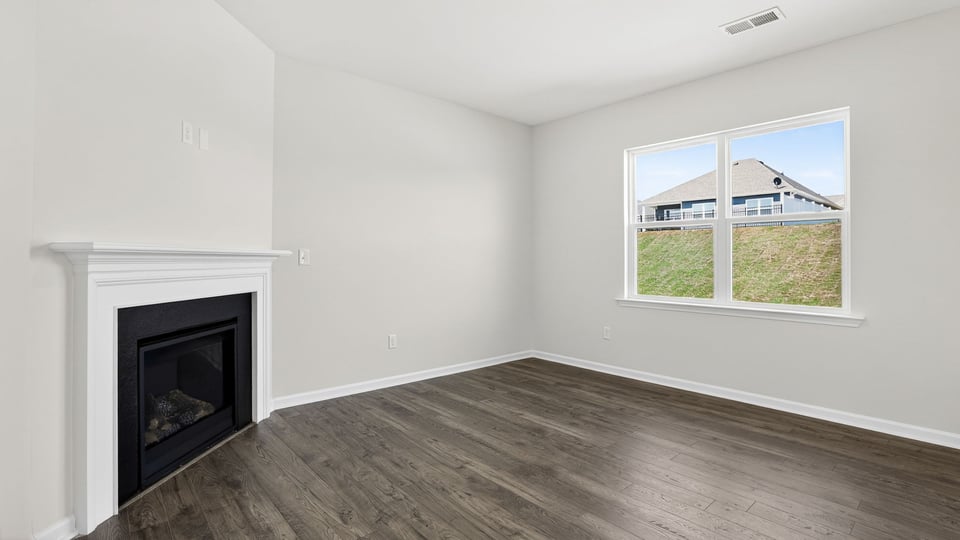 Family room with windows and fireplace.