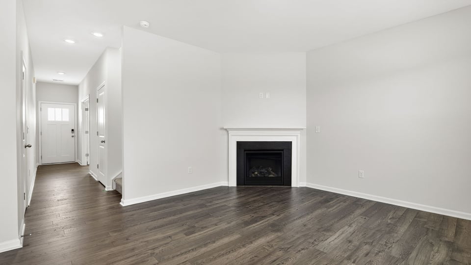 Family room with windows and fireplace.