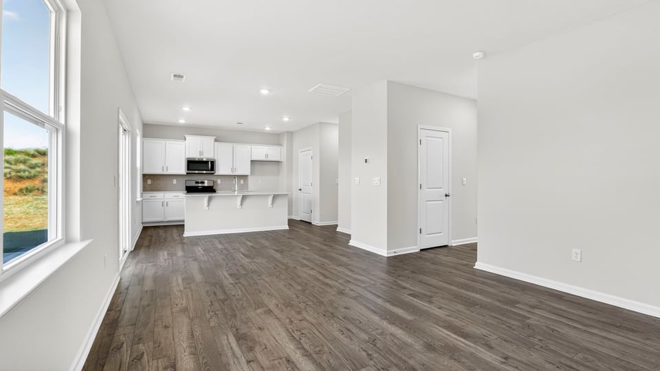Family room with windows and fireplace.