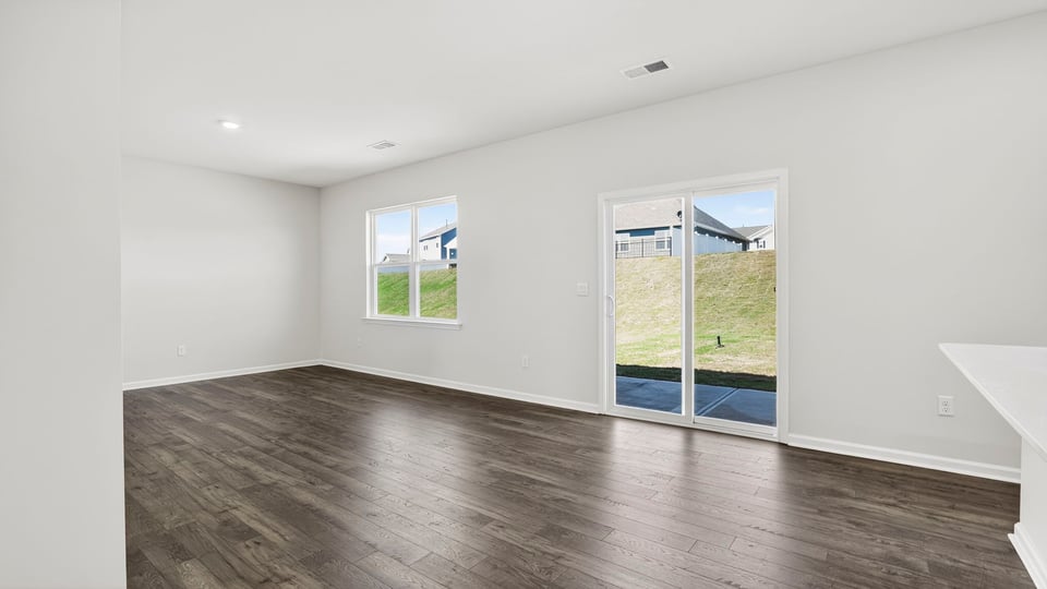 Family room with windows and fireplace.