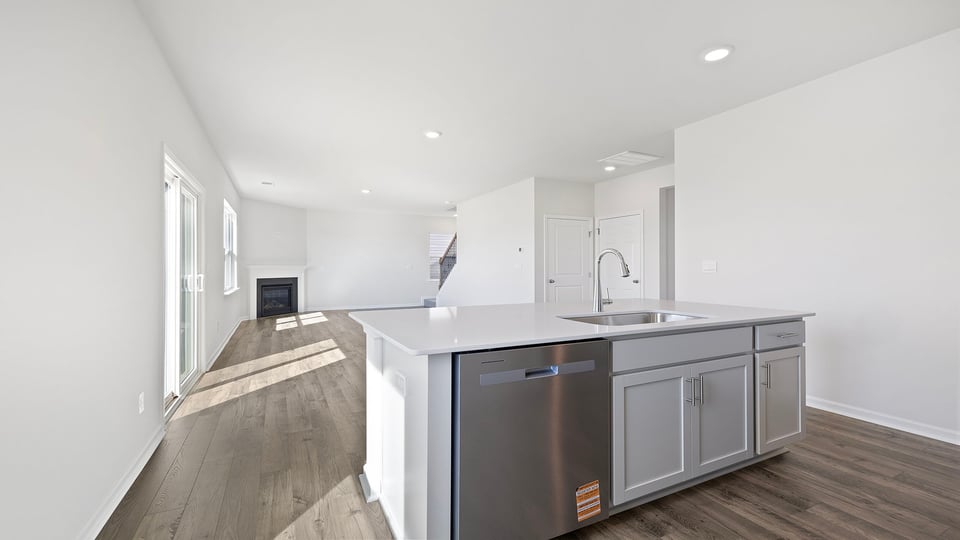 Kitchen with island with granite countertops.