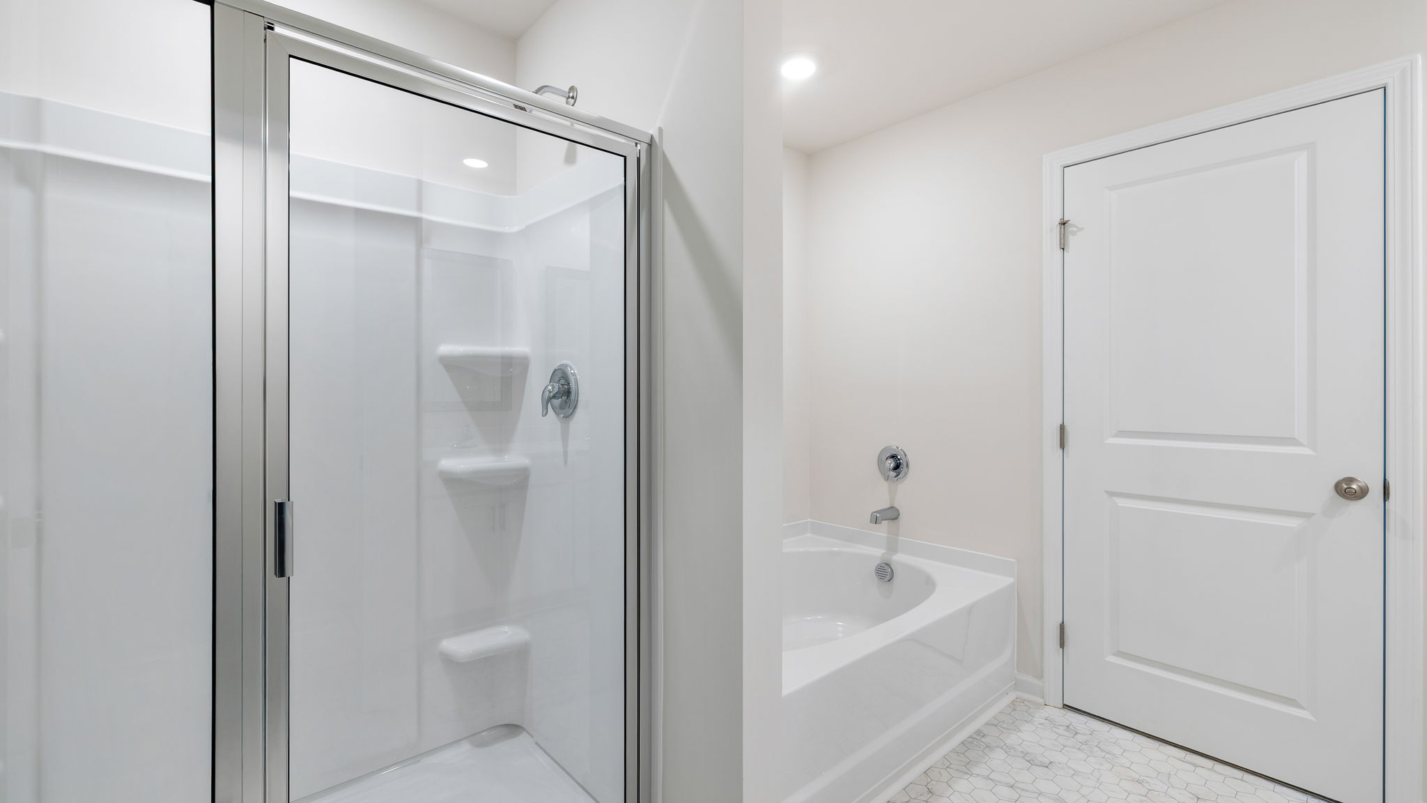 Bathroom with walk in shower and tub.