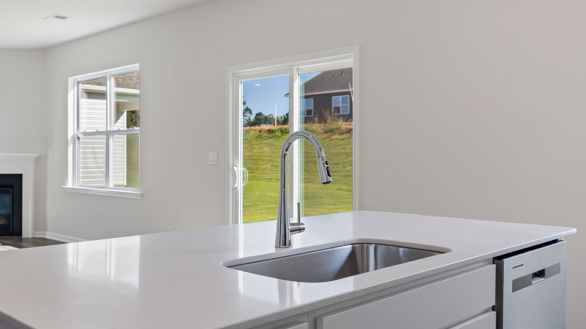Kitchen and island with granite counter tops.