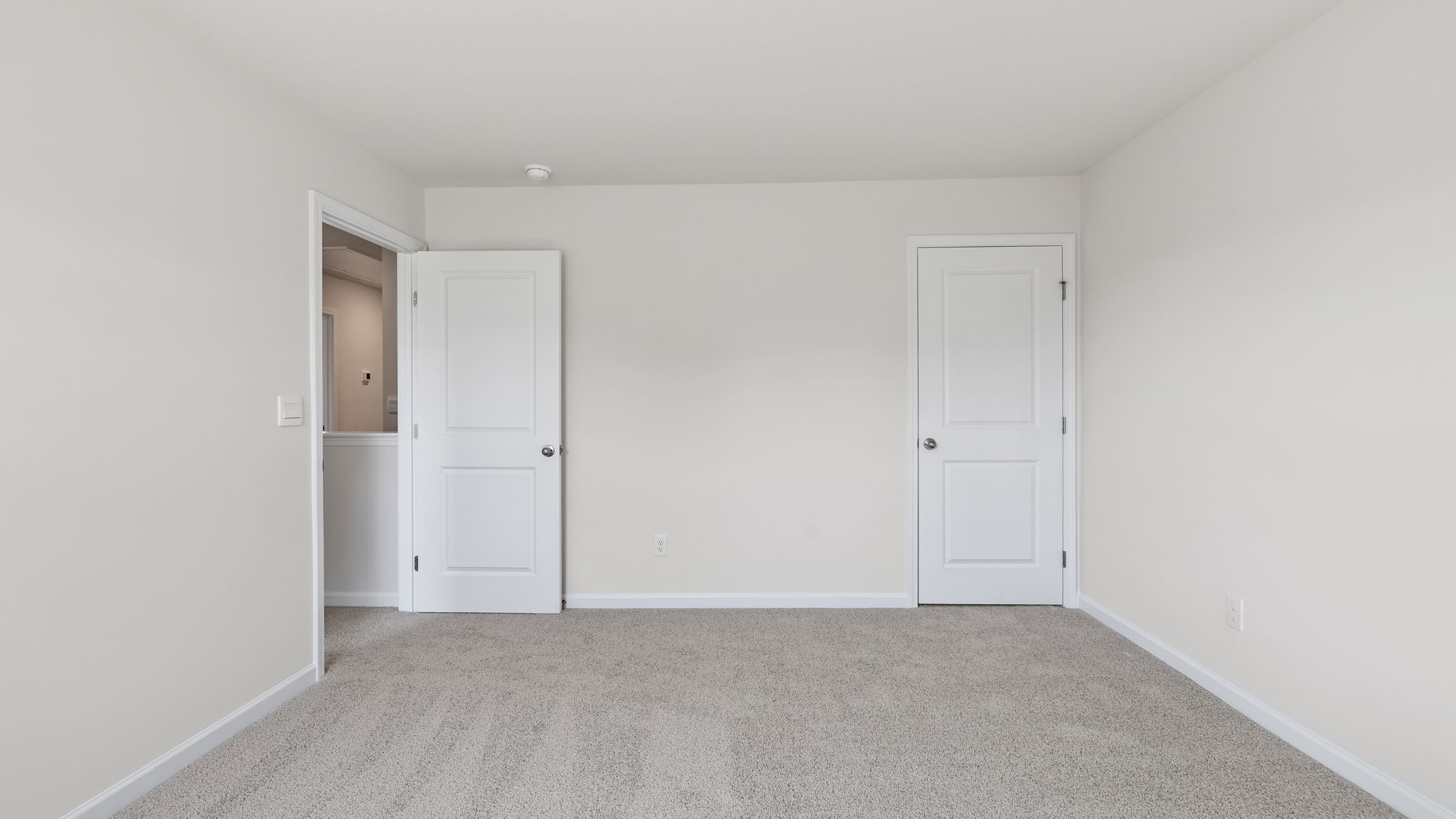 Bedroom with carpet.