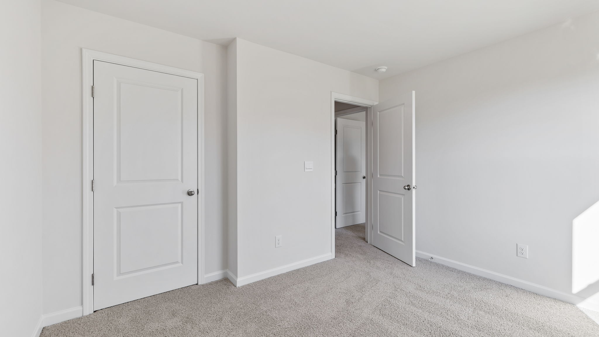 Bedroom with carpet.