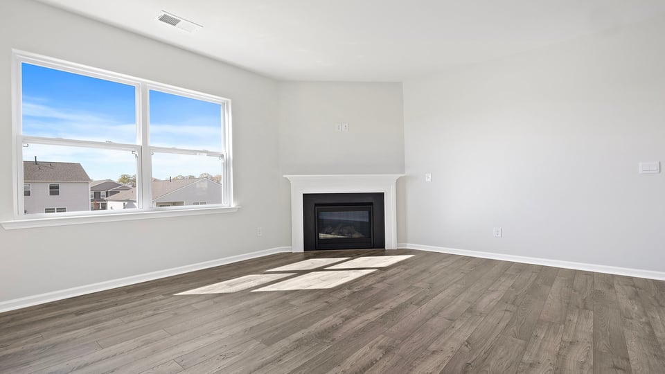 Great room with fireplace and windows.