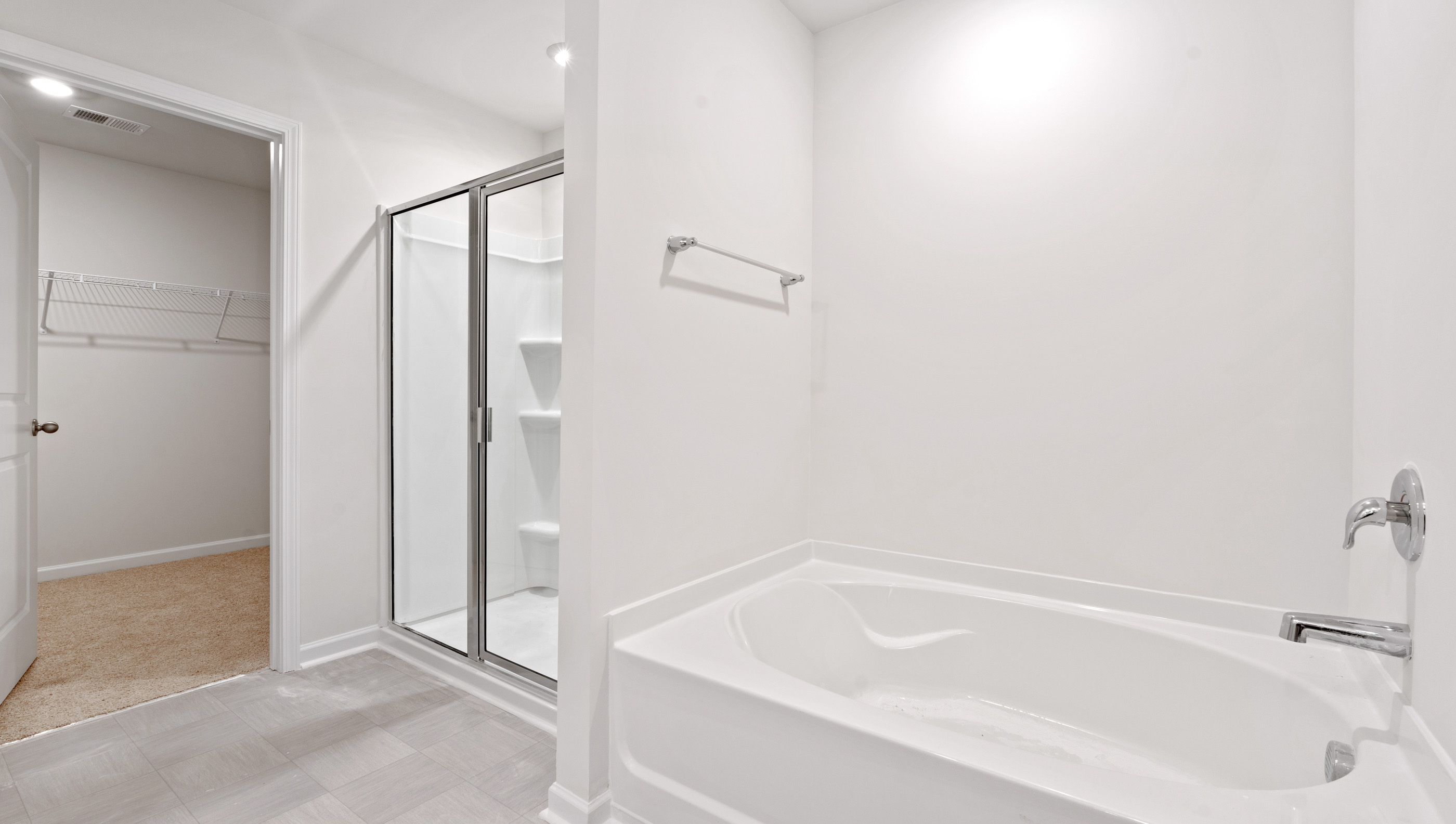 Bathroom with tub and walk in shower.