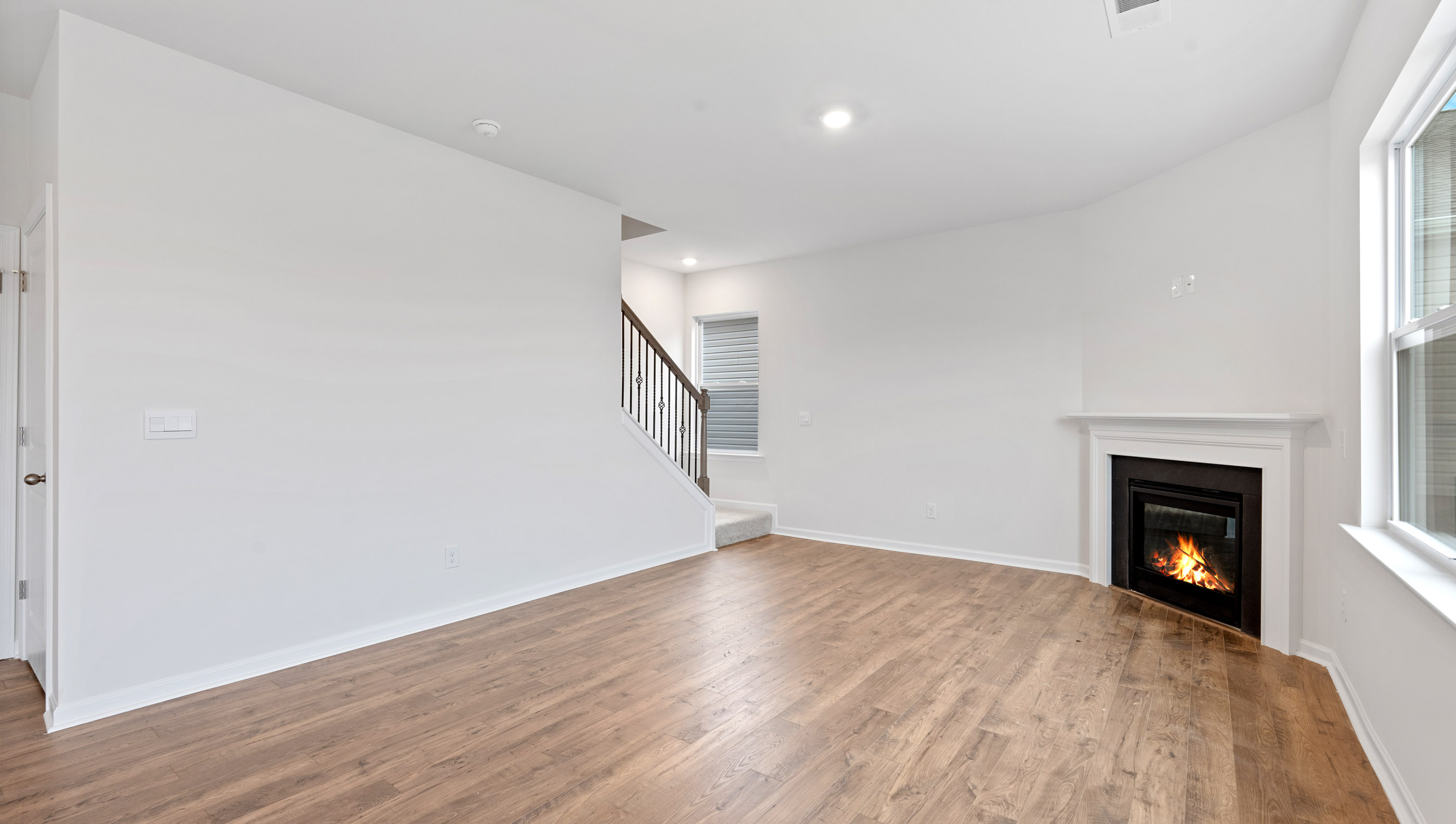 Great room with fireplace and windows.