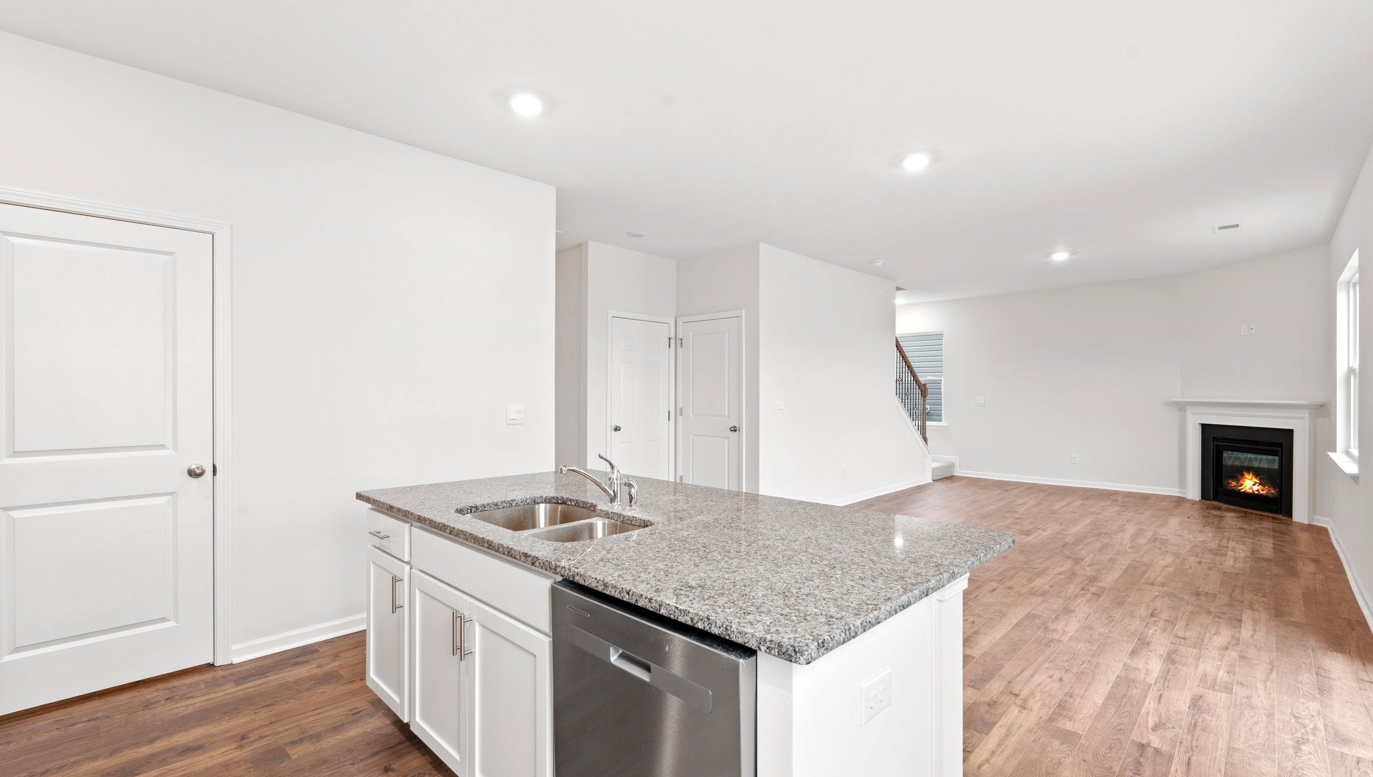 Kitchen and island with granite countertop.