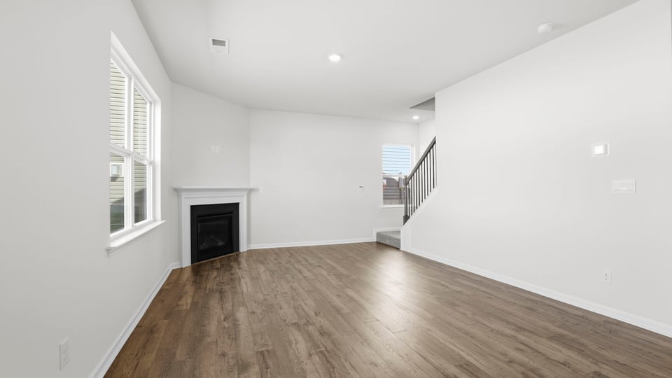 Family room with windows and fireplace.