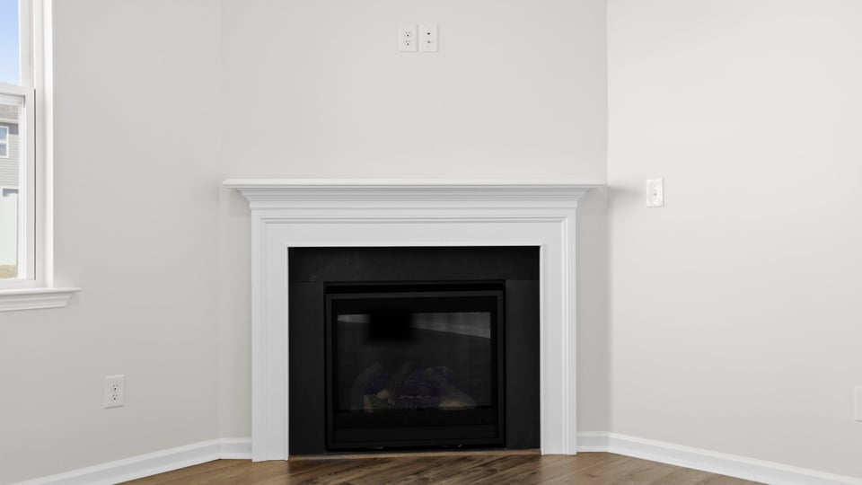 Family room with windows and fireplace.