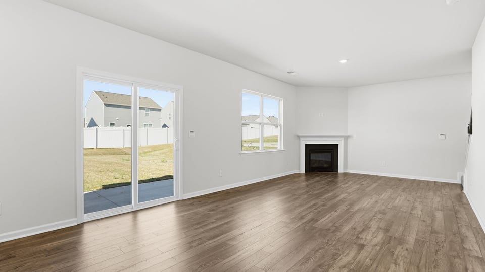 Family room with windows and fireplace.