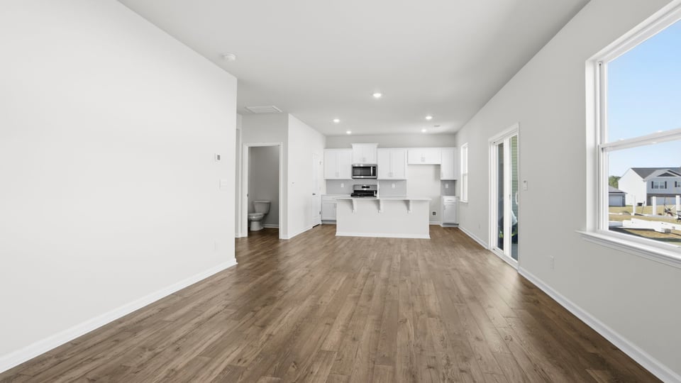 Family room with windows and fireplace.