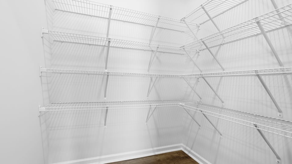 Closet with hanging storage racks.