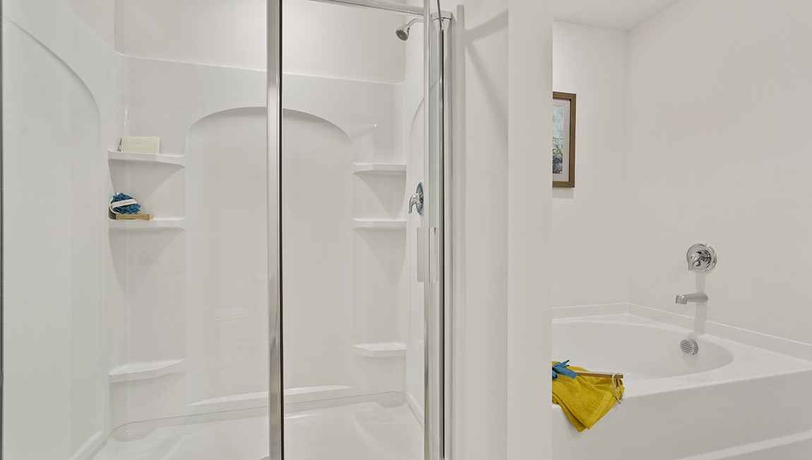 Walk in shower in bathroom.