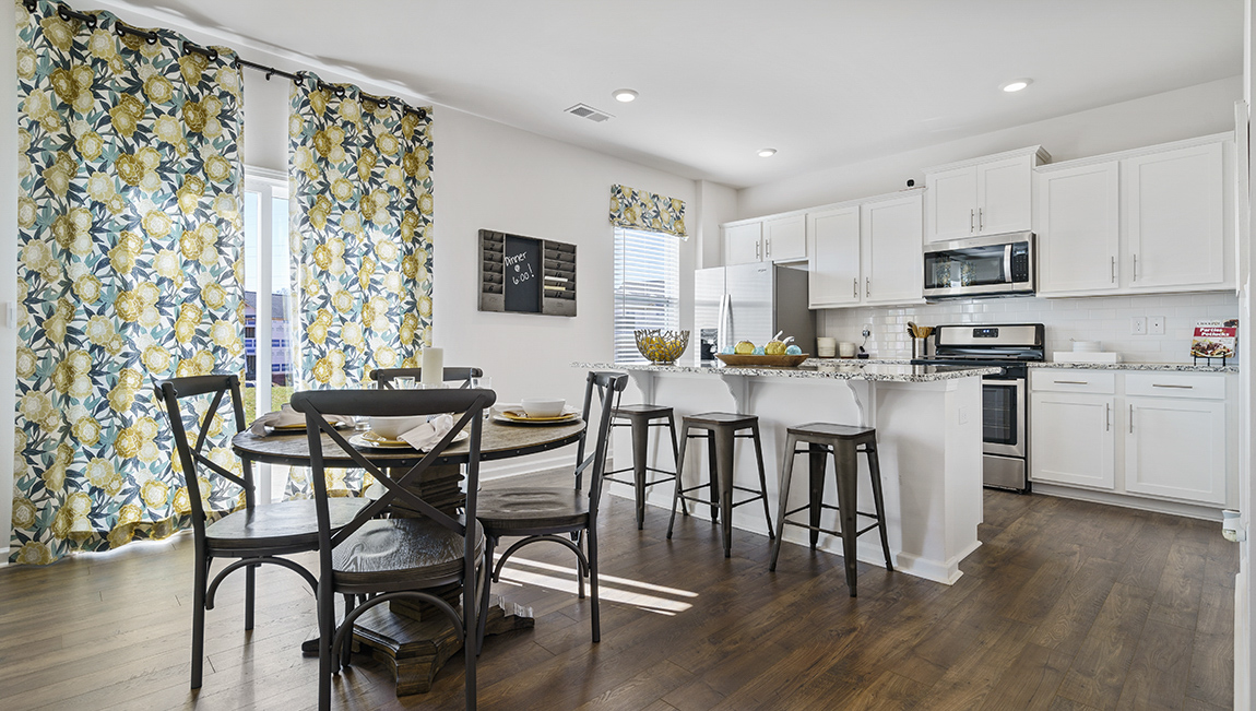 Kitchen and island with granite counter tops.