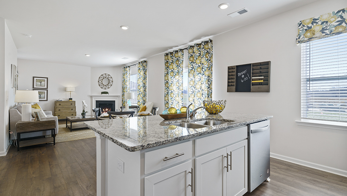 Kitchen and island with granite counter tops.