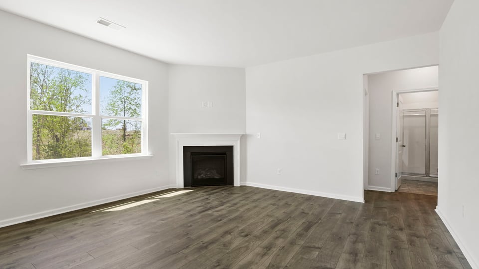 Family room with windows and fireplace.