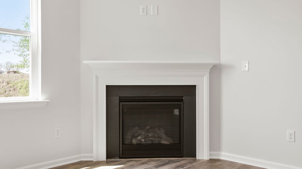 Family room with windows and fireplace.