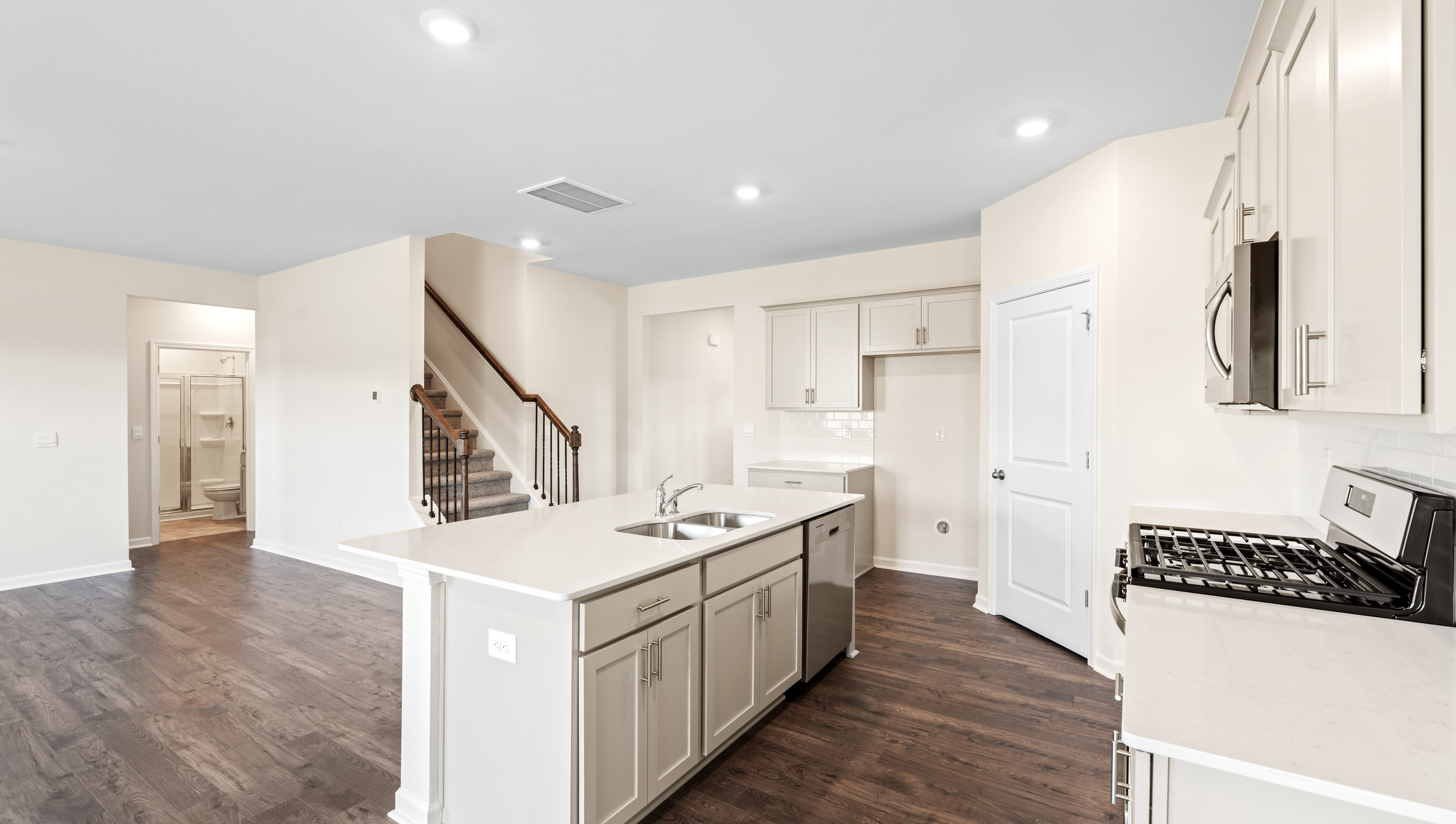 Kitchen with island and granite countertops.