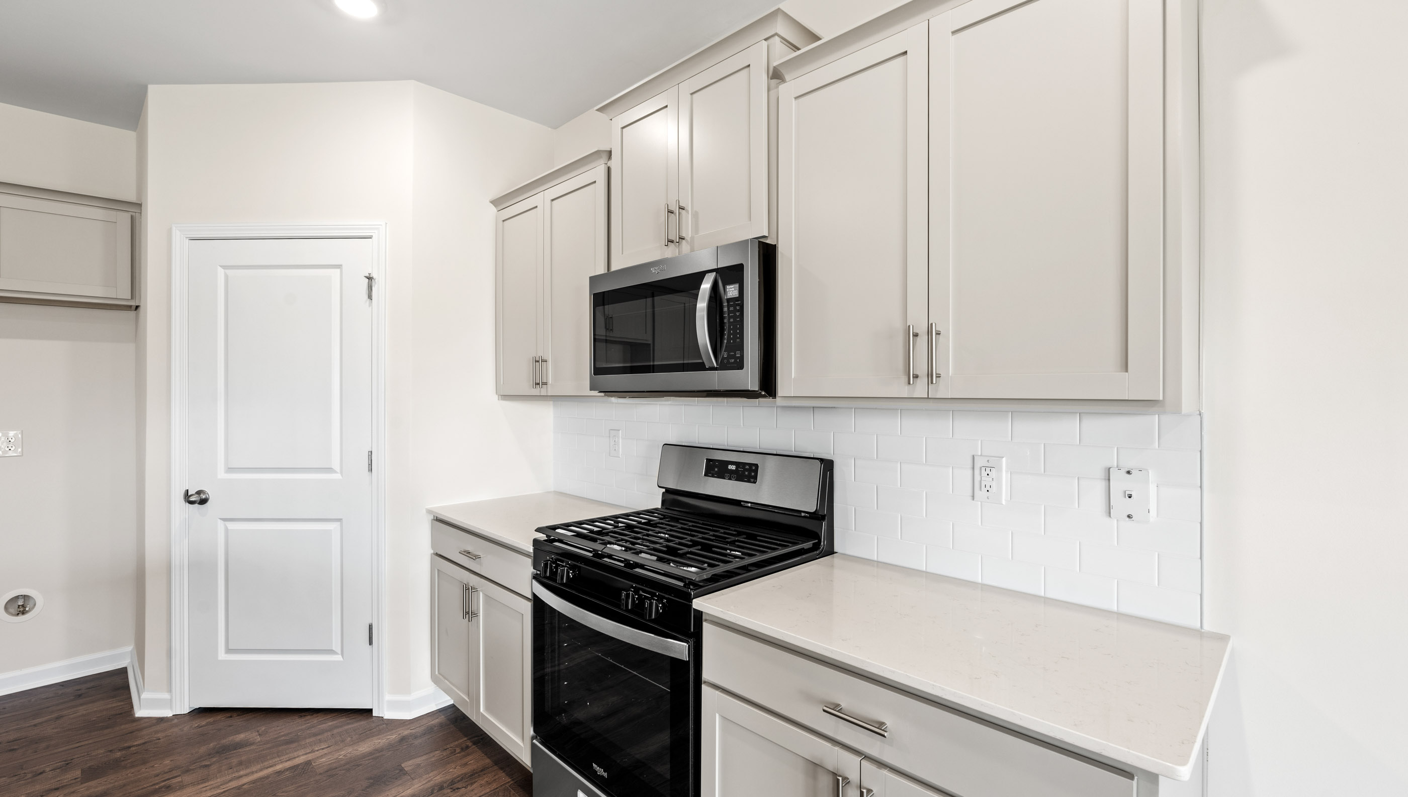 Kitchen with granite countertops and stainless steel appliances.
