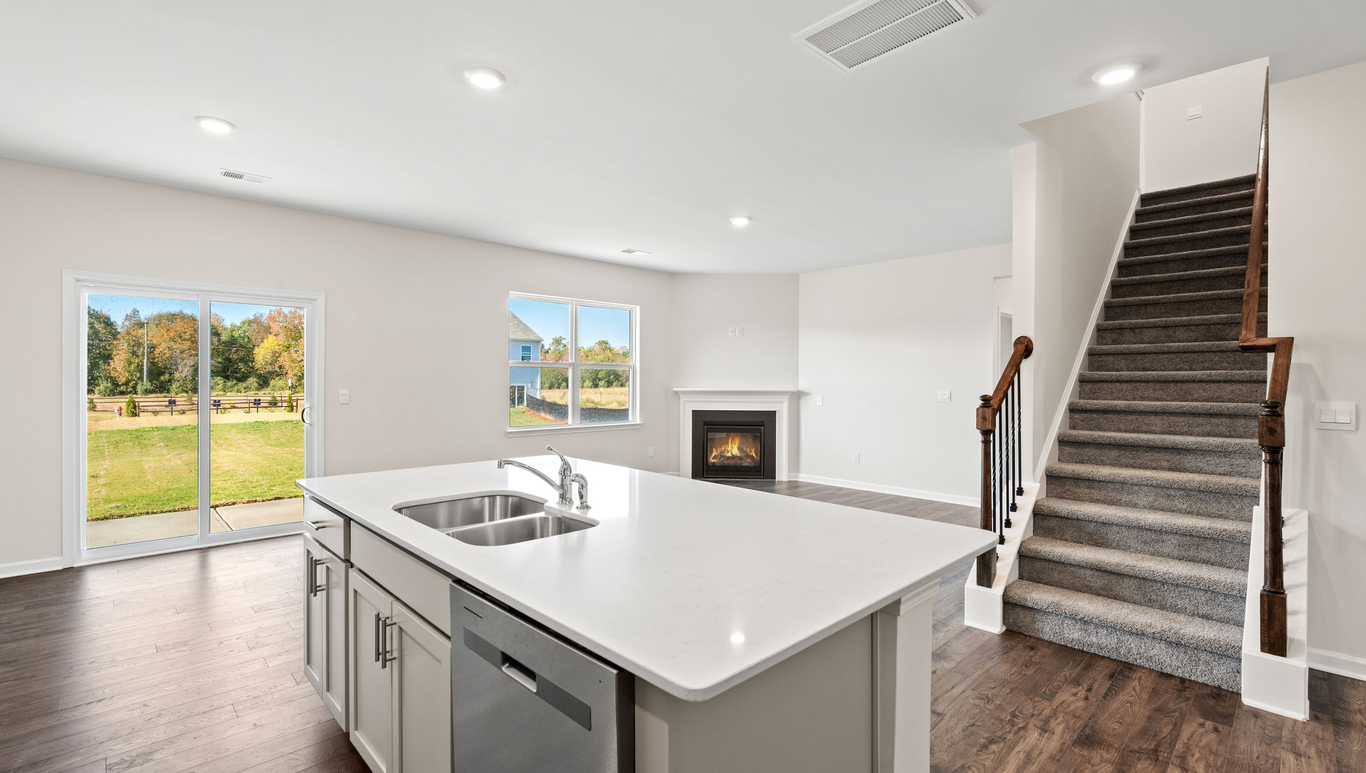 Kitchen with island and granite countertops.