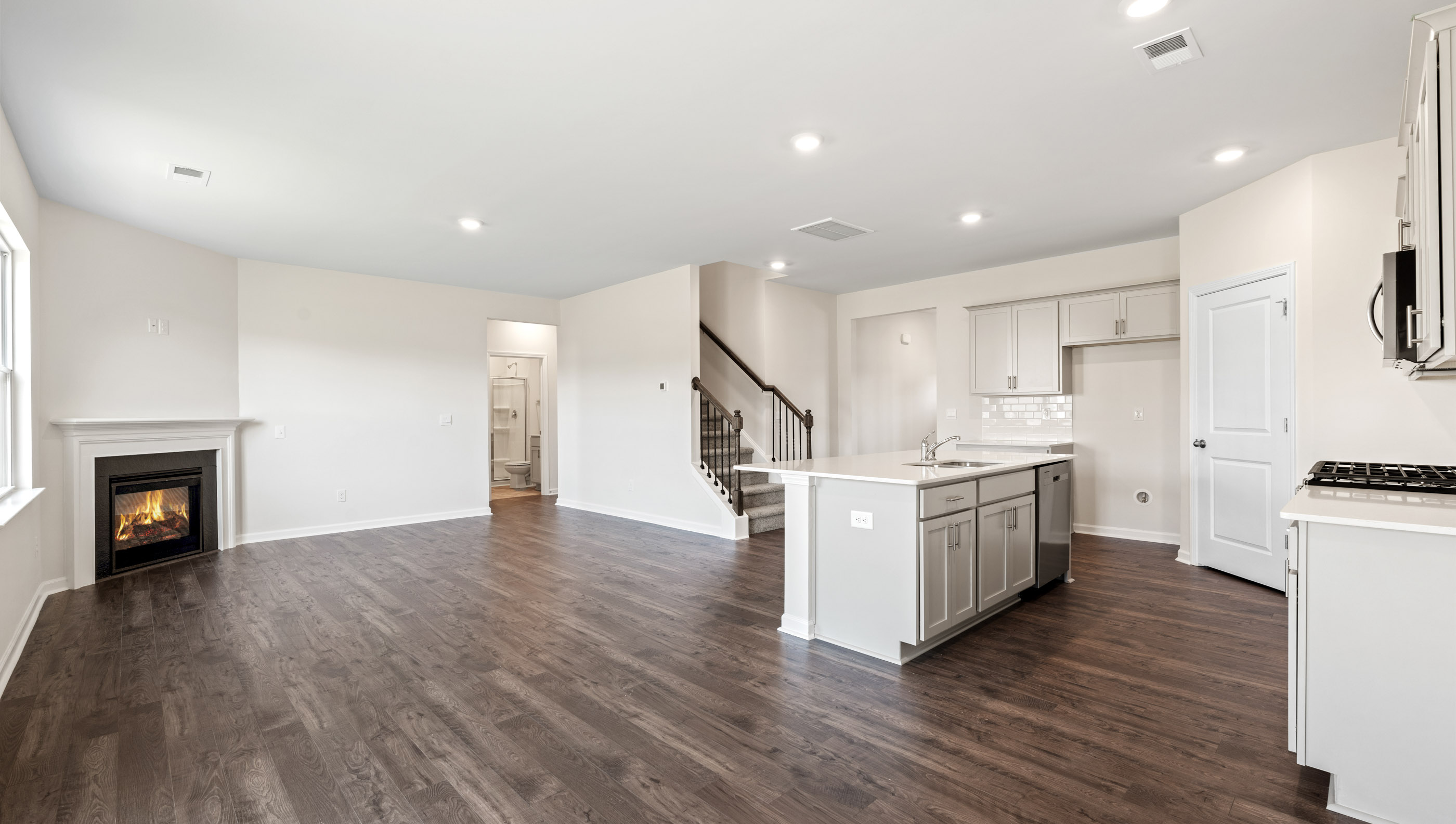 Kitchen with island and granite countertops.