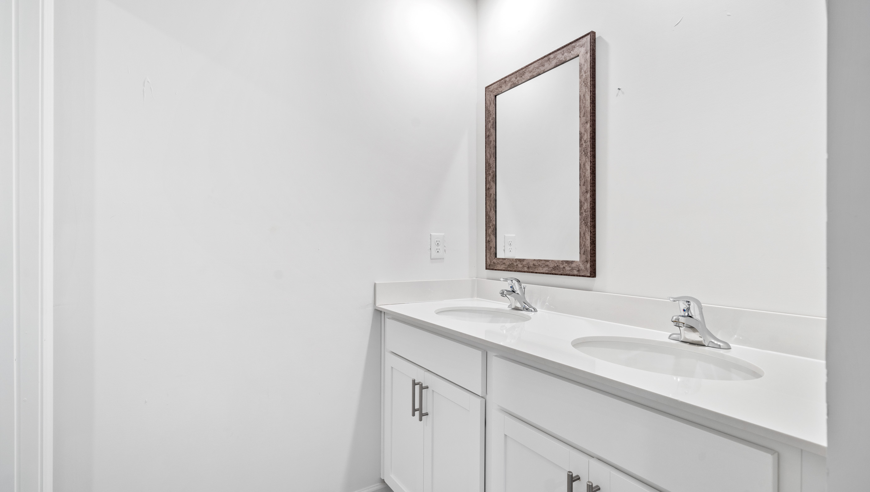 Bathroom with dual vanity.