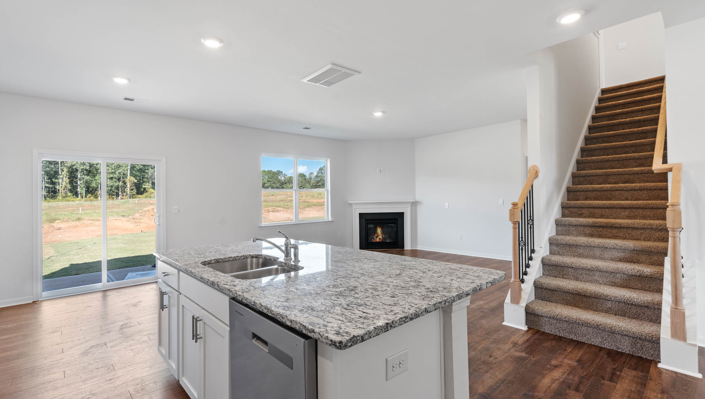 Kitchen and island with granite countertops.