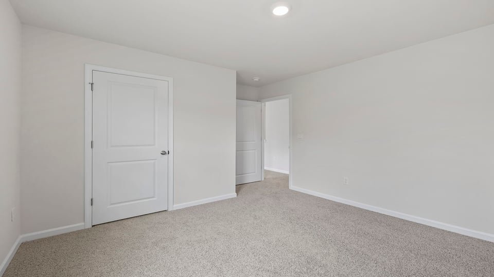 Bedroom with carpet.