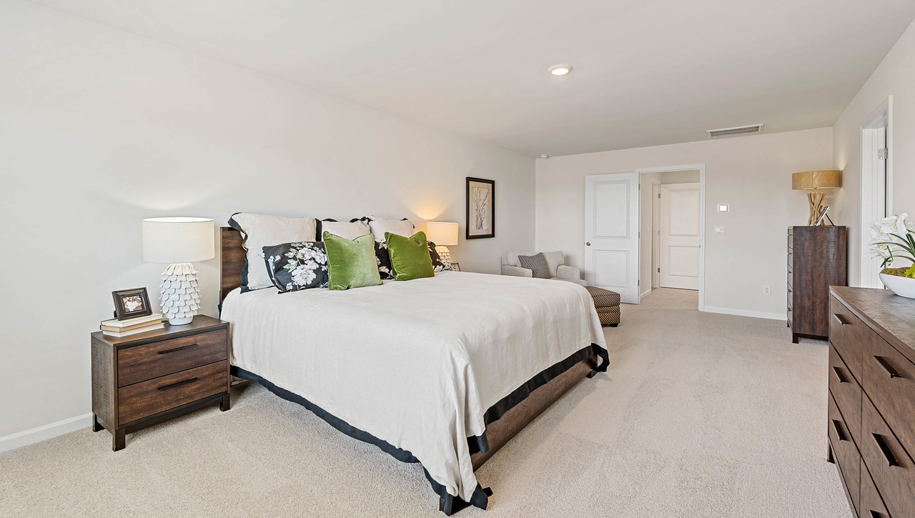 Bedroom with carpet and window.